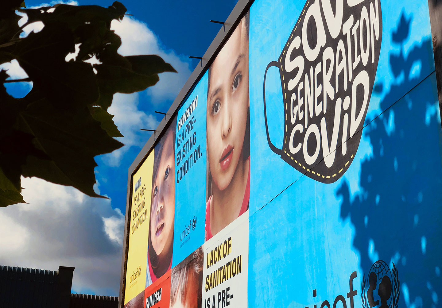 a billboard of pictures of children