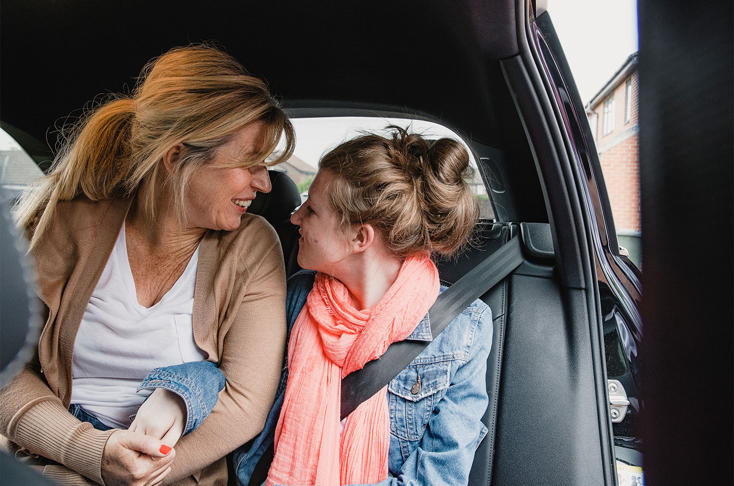 woman and daughter smiling to each other